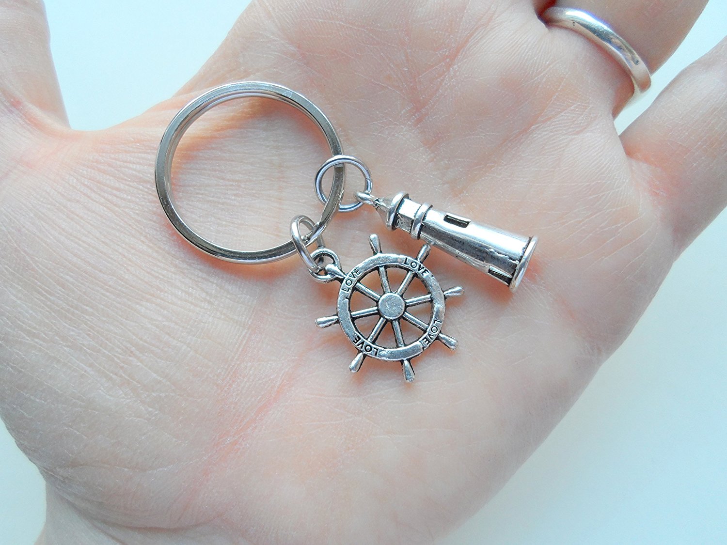 Silver keychain with helm.