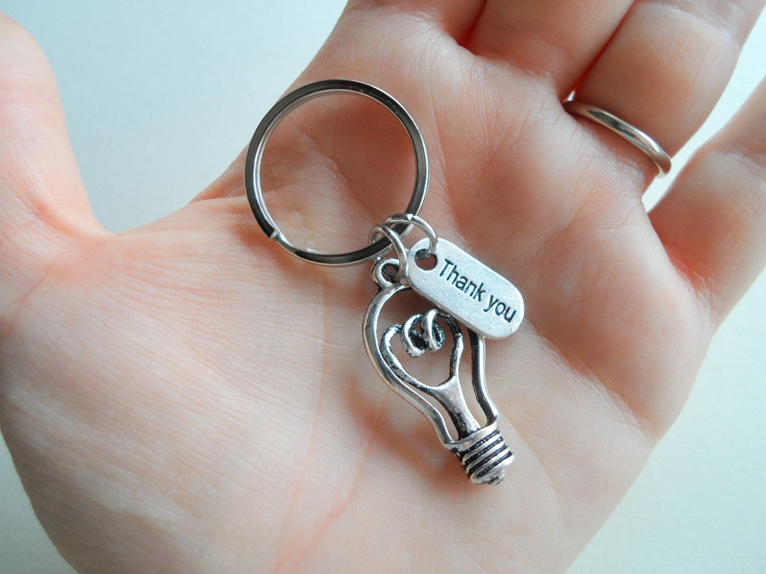 https://www.jewelry-everyday.com/cdn/shop/products/Teacher_Appreciation_Gift_Thank_You_Charm_and_Light_Bulb_Charm_Keychain_Thanks_for_helping_to_make_my_future_bright_Teacher_Gift_h.jpg?v=1604021658